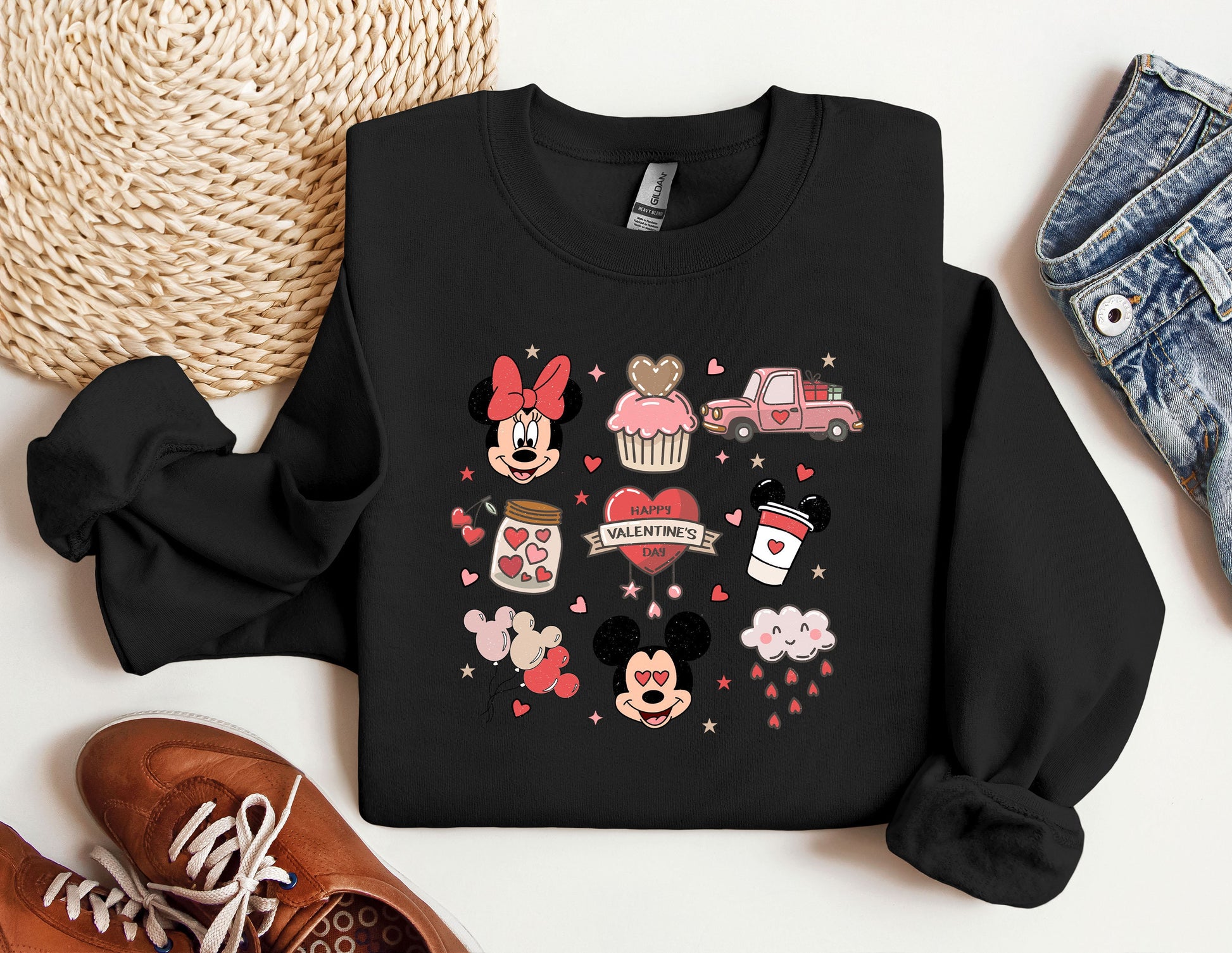 a mickey mouse and minnie mouse shirt next to a pair of sneakers