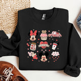 a mickey mouse and minnie mouse shirt next to a pair of sneakers