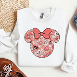 a white shirt with a pink bow on it