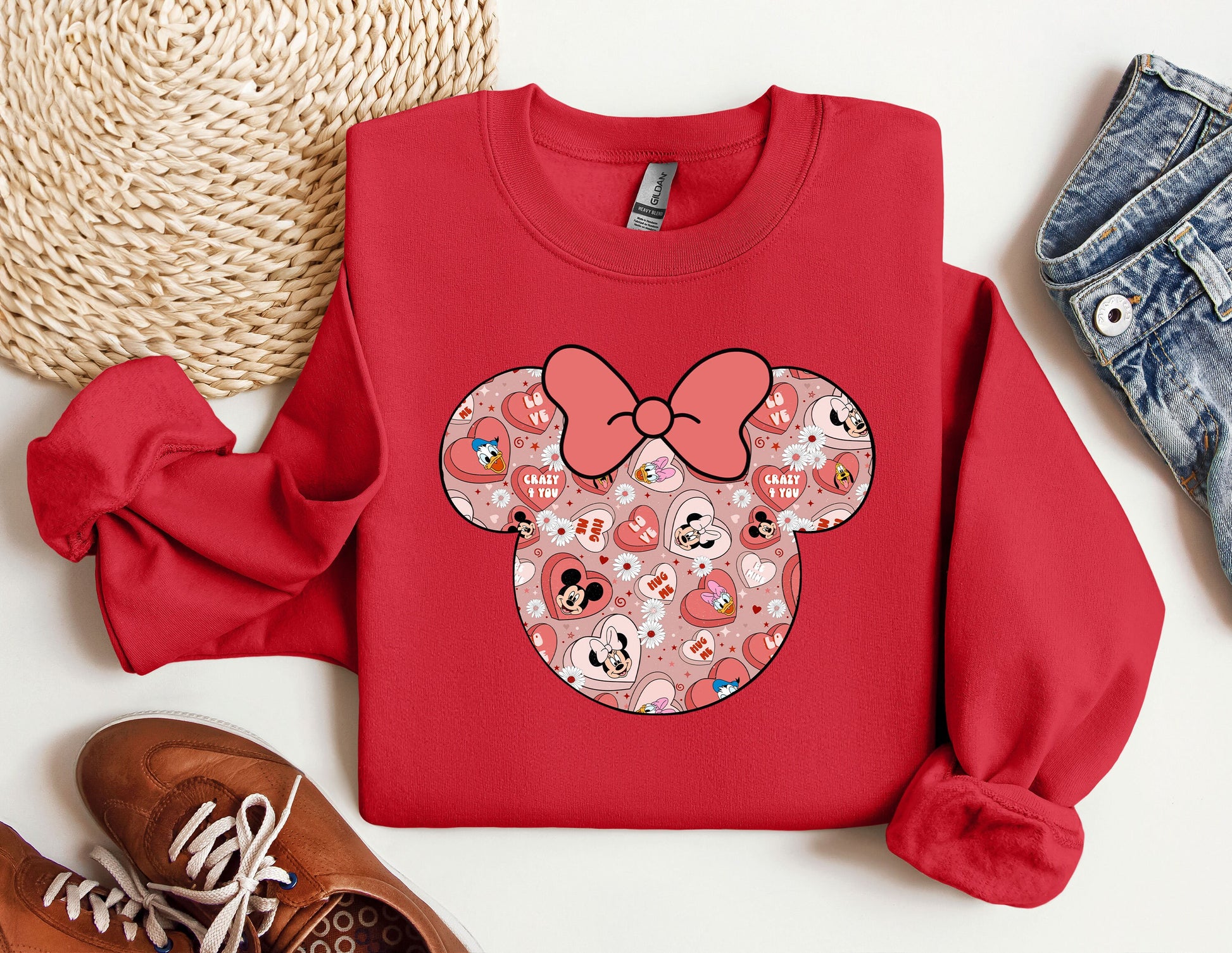 a red shirt with a minnie mouse face on it