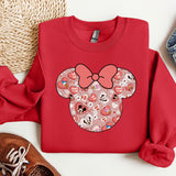a red shirt with a minnie mouse face on it