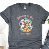 a mickey mouse t - shirt sitting on top of a table