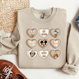 a sweater with mickey mouse and mickey mouse hearts on it