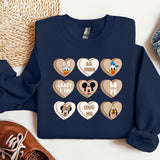 a blue sweater with mickey mouse hearts on it