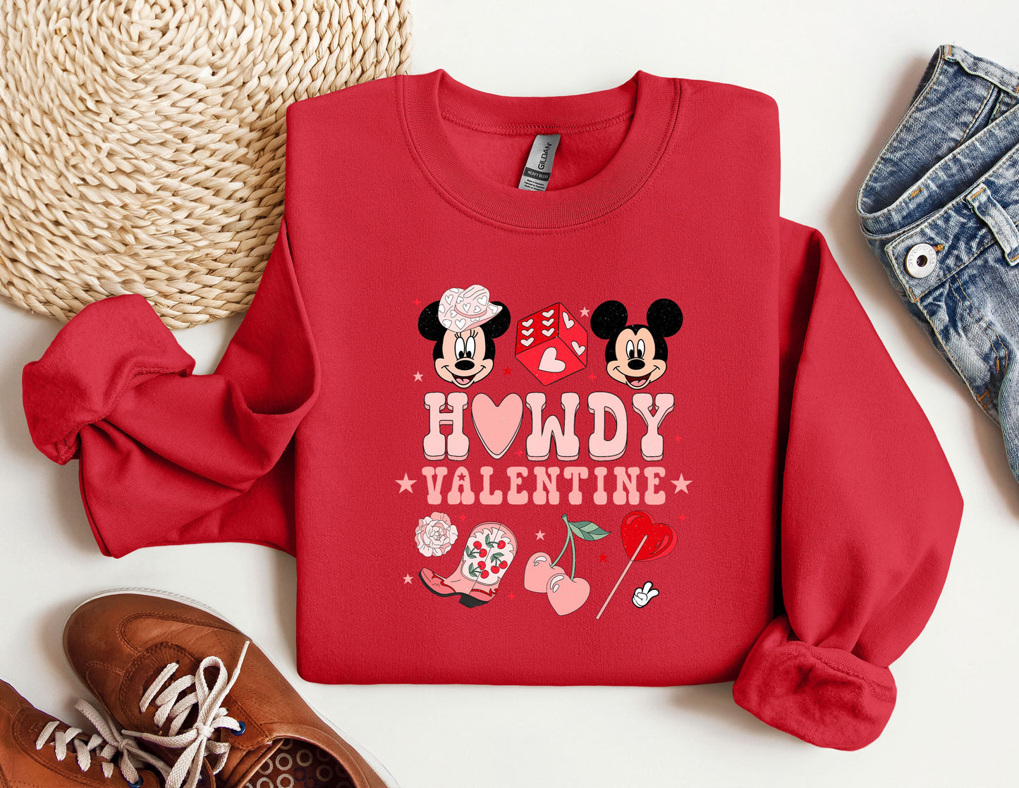 a red sweatshirt with mickey and minnie mouses on it