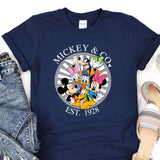 a mickey mouse and friends t - shirt on a pair of jeans