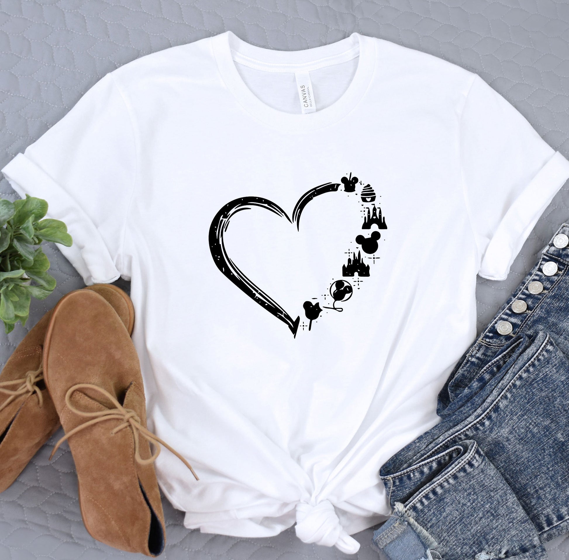 a white t - shirt with a heart drawn on it