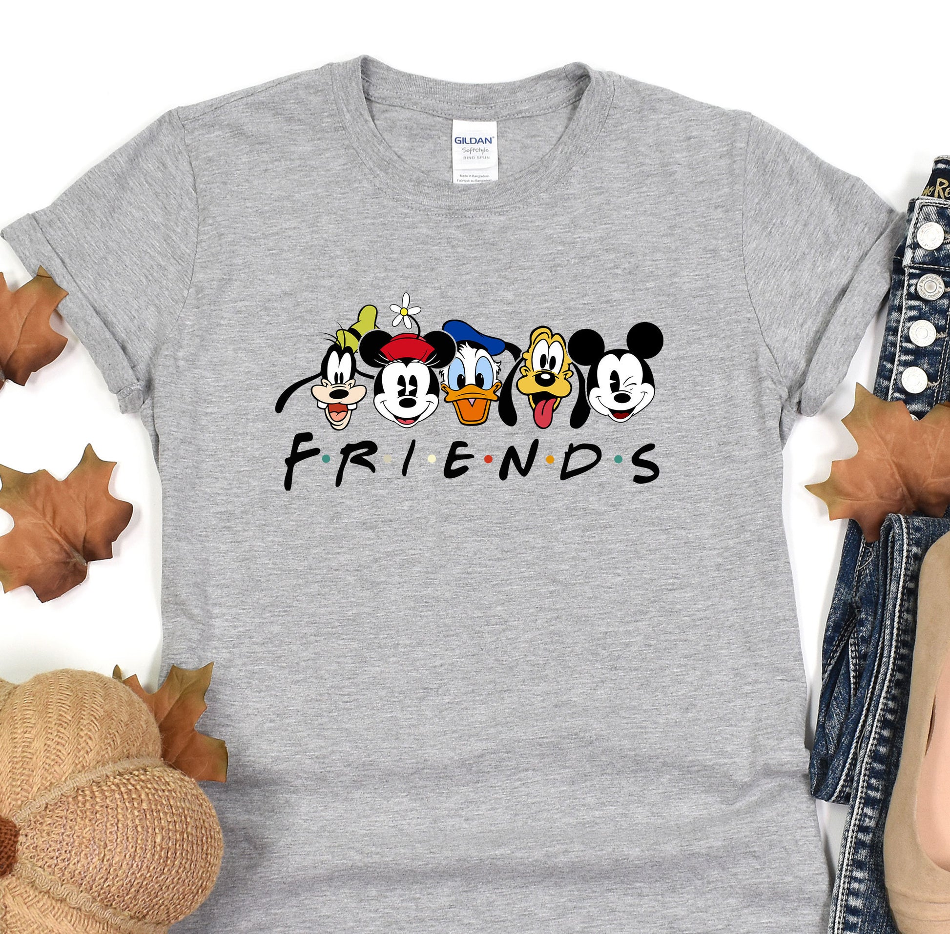 a gray shirt with mickey mouse and friends on it