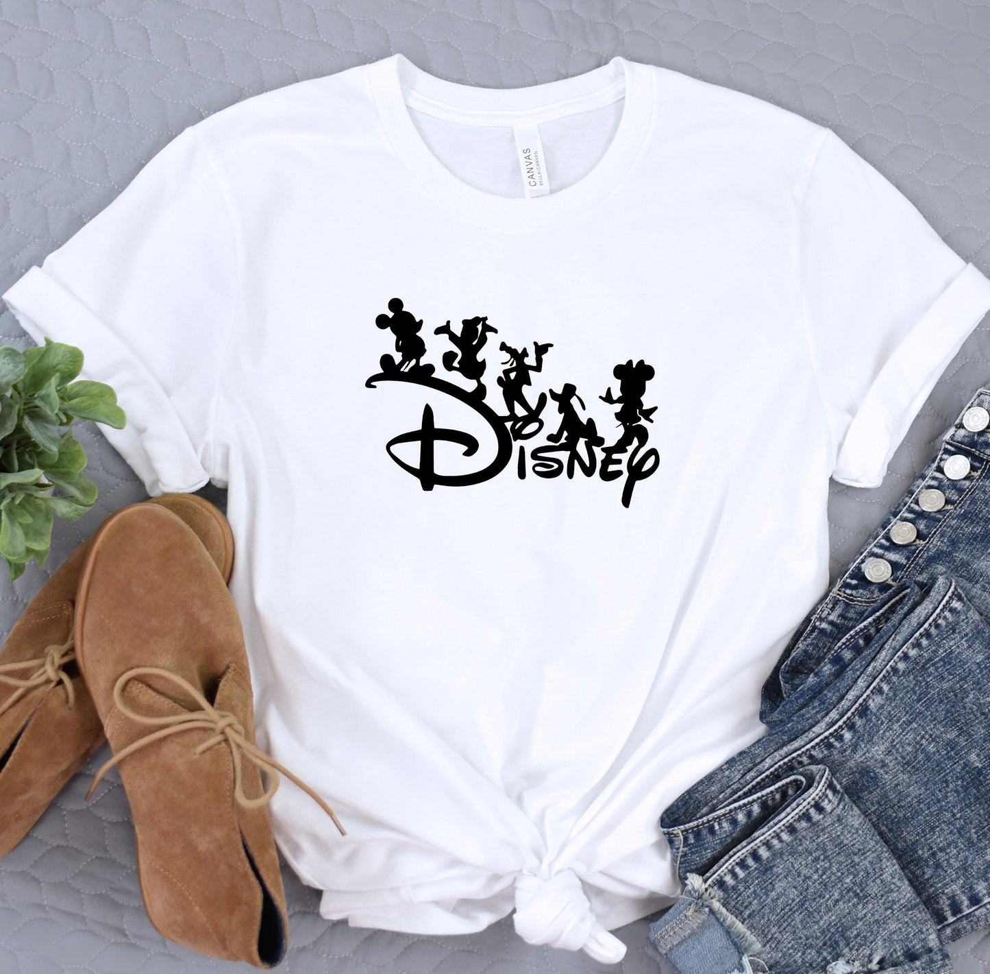 a t - shirt with the disney logo on it