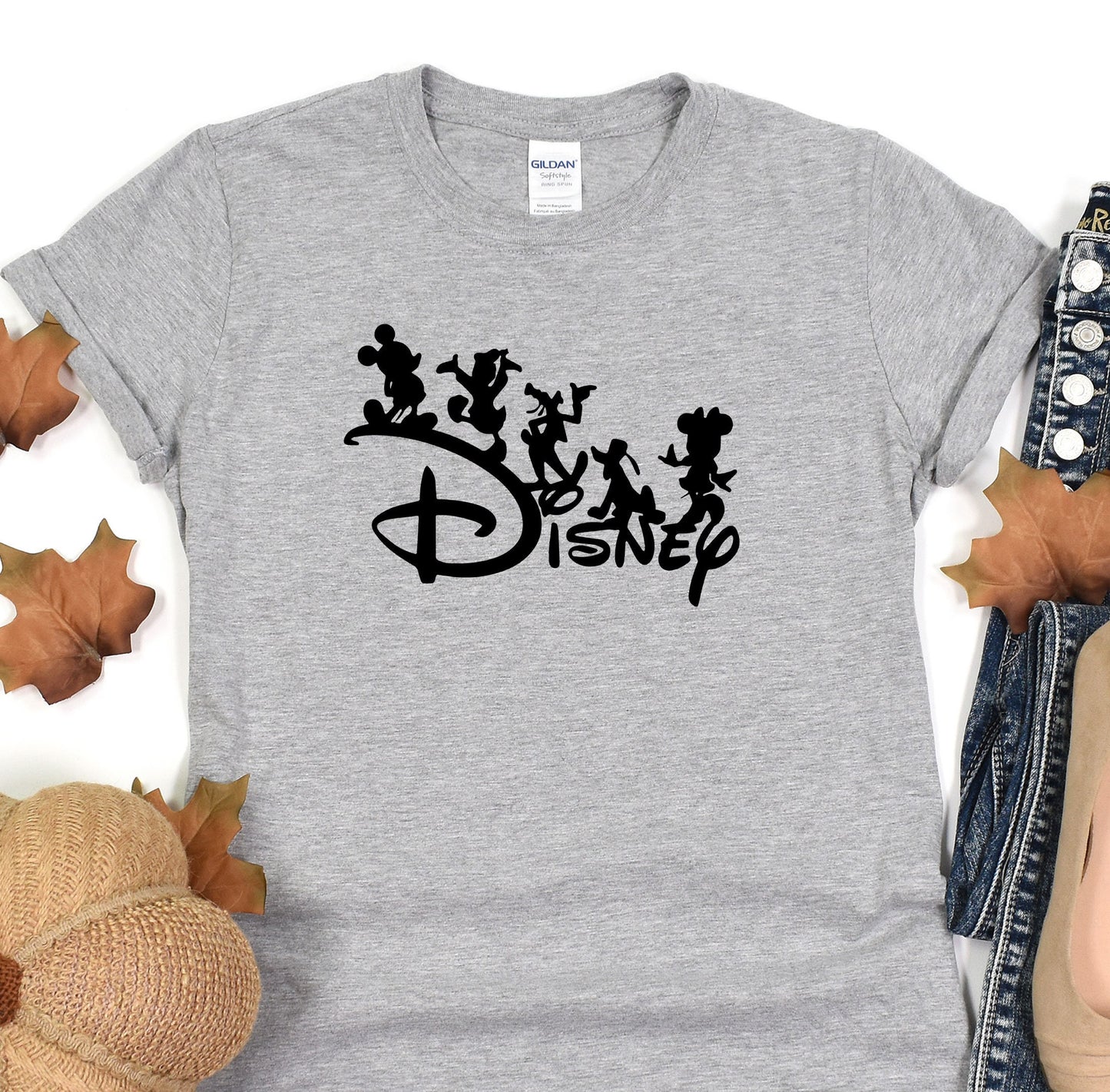 a gray shirt with the disney logo on it