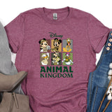 an animal kingdom t - shirt on a pile of clothes