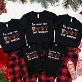 a family of four wearing matching christmas pajamas