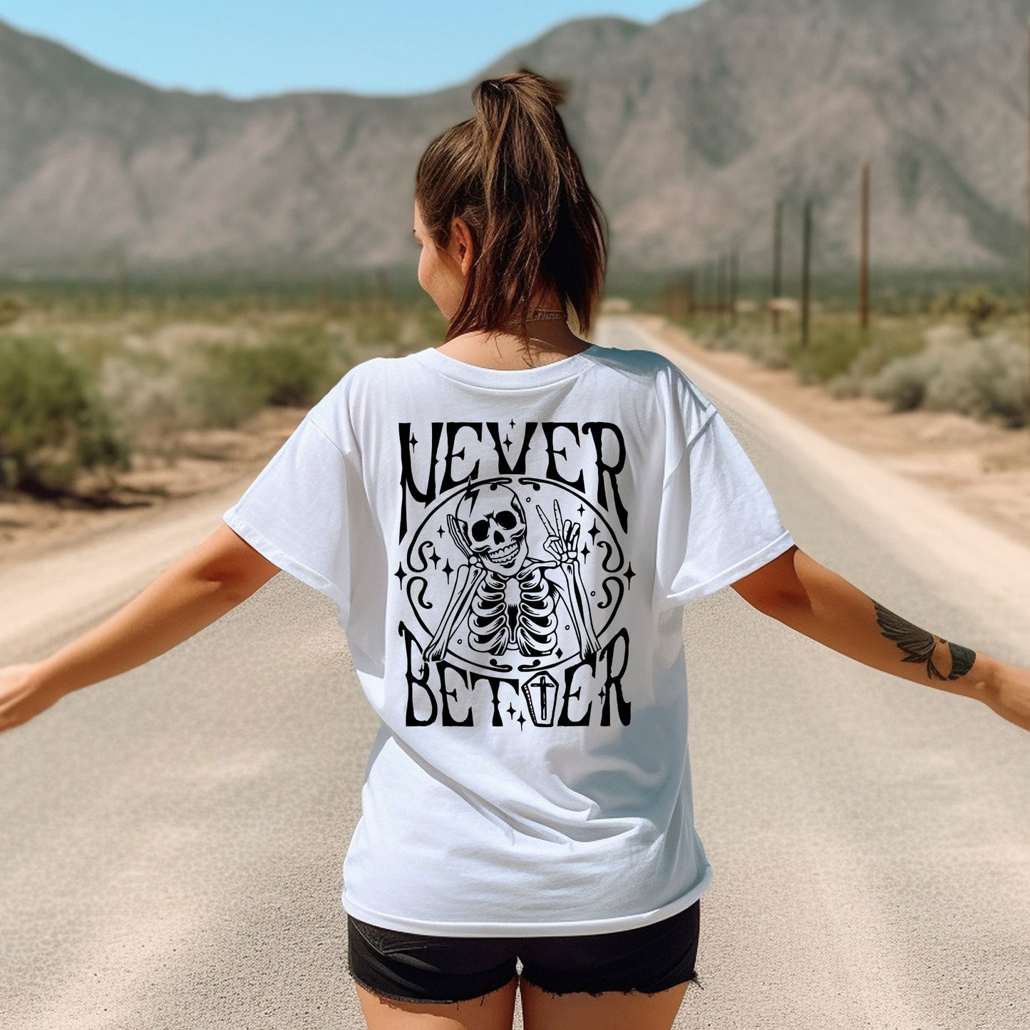 a woman walking down a road with her arms outstretched