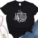a black t - shirt with a hand holding a knife