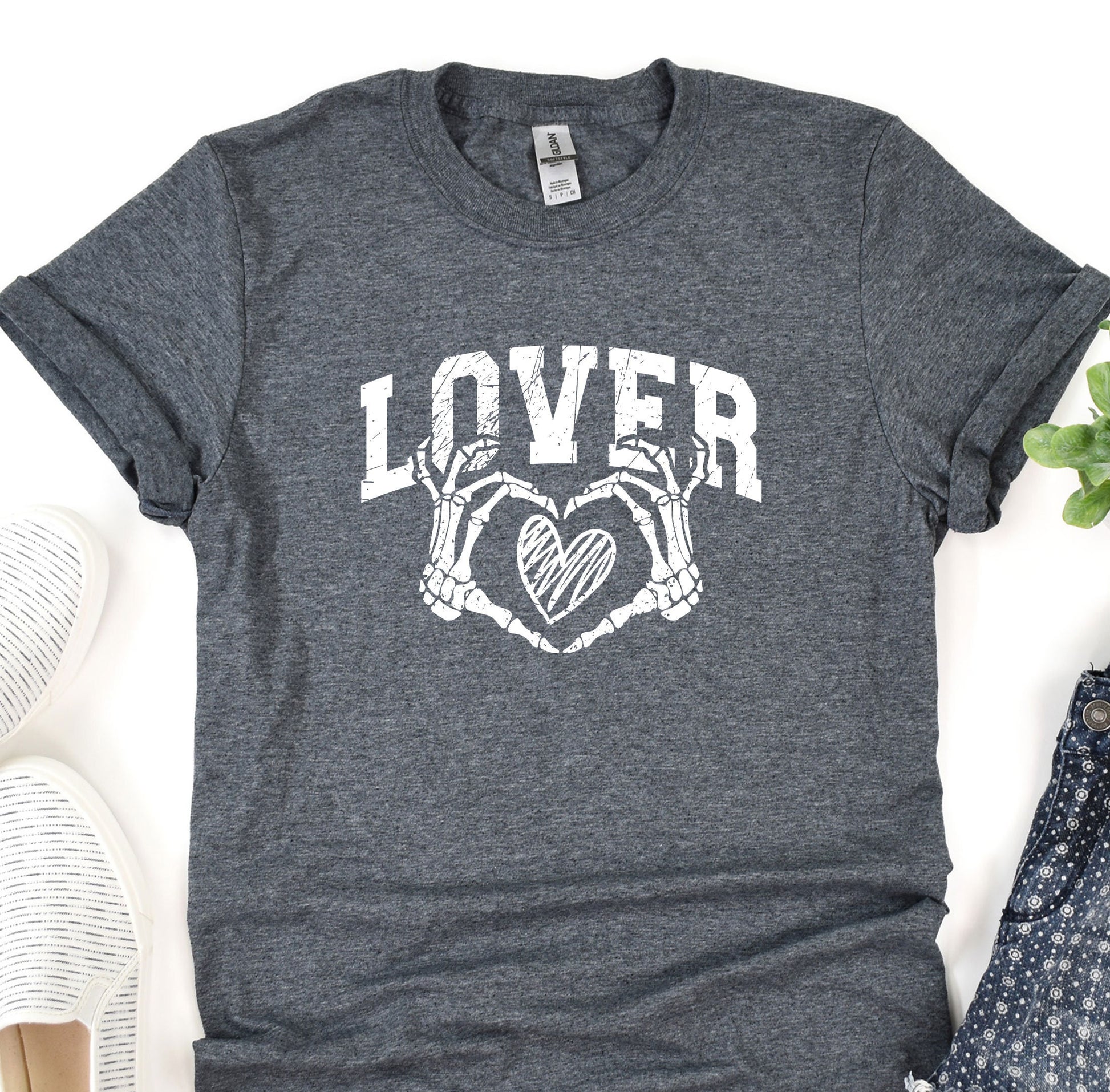 a t - shirt that says lover with two hands holding a heart