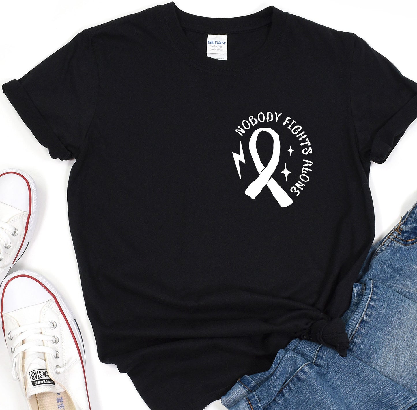 a black shirt with a white ribbon on it