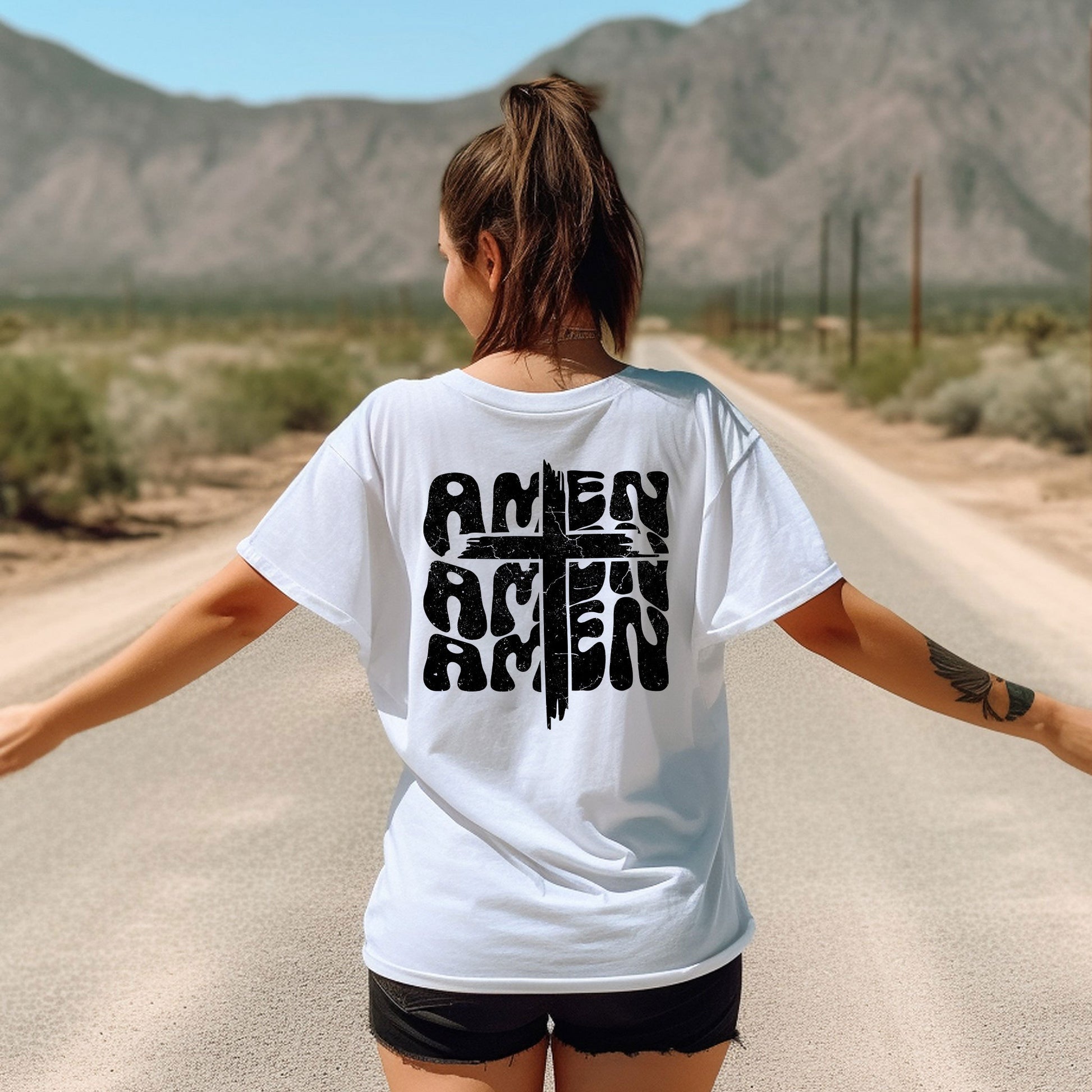 a woman walking down a road with her arms outstretched