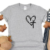 a t - shirt with a heart and a cross on it