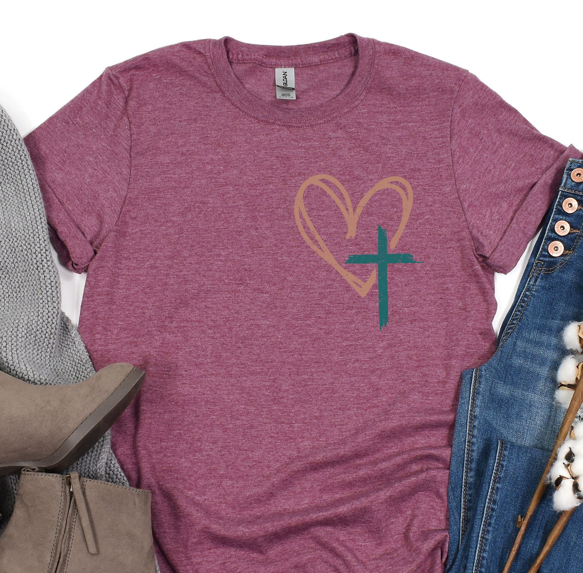 a t - shirt with a heart and a cross on it