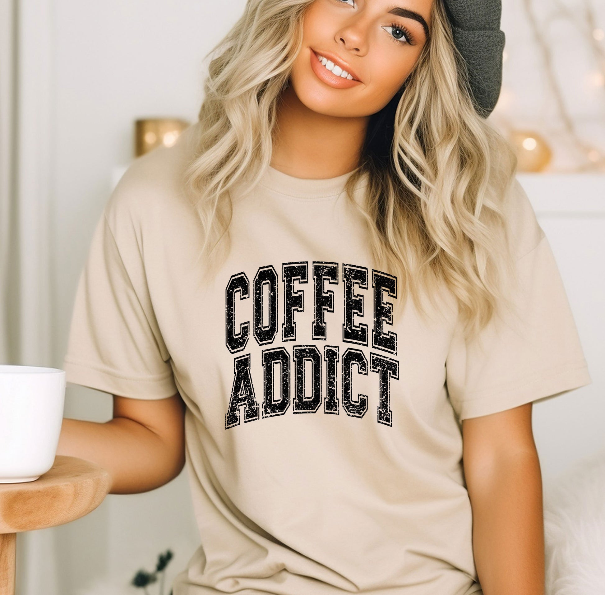 a woman wearing a coffee addict t - shirt