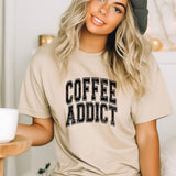 a woman wearing a coffee addict t - shirt