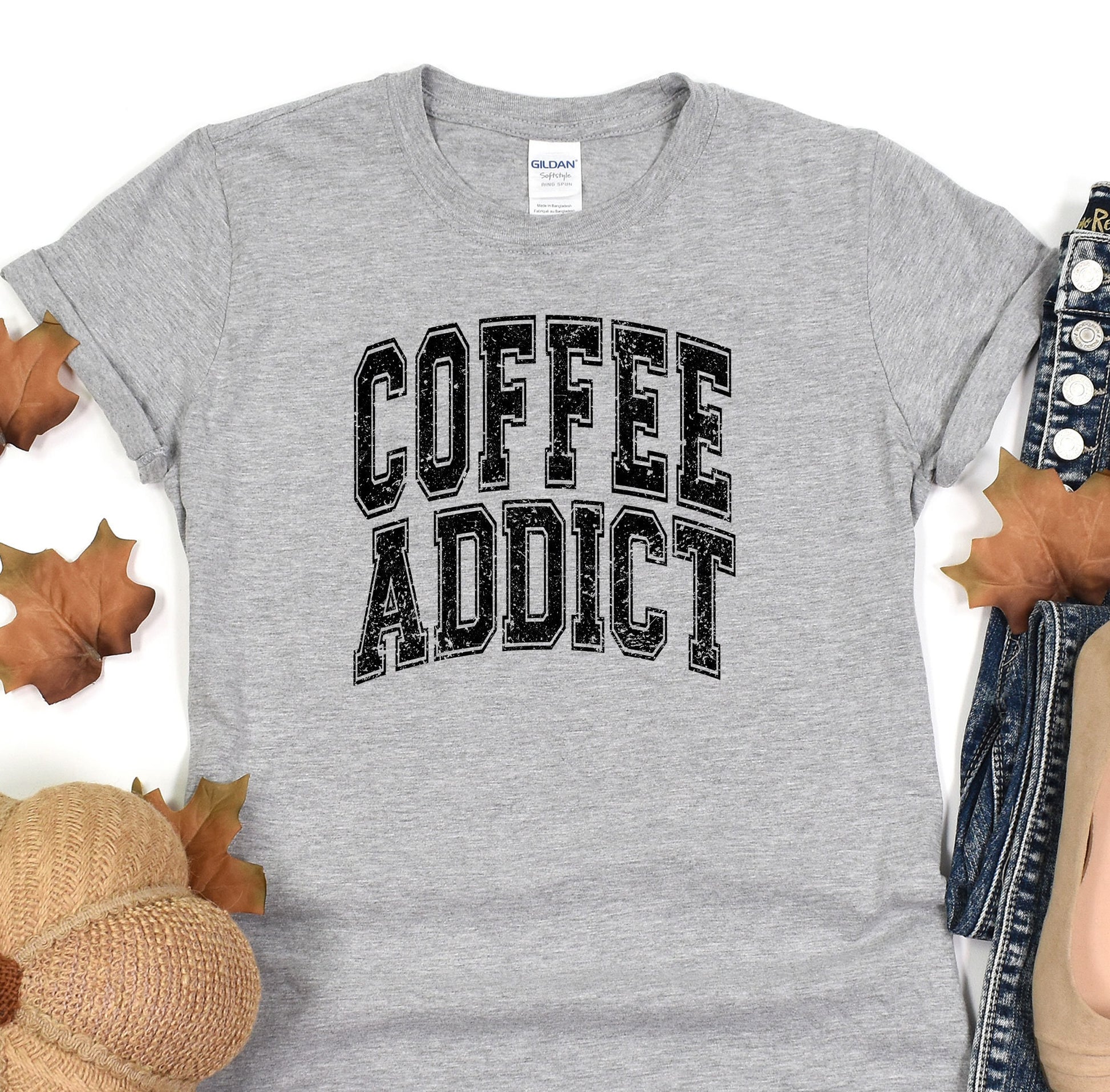 a t - shirt that says coffee addict on it