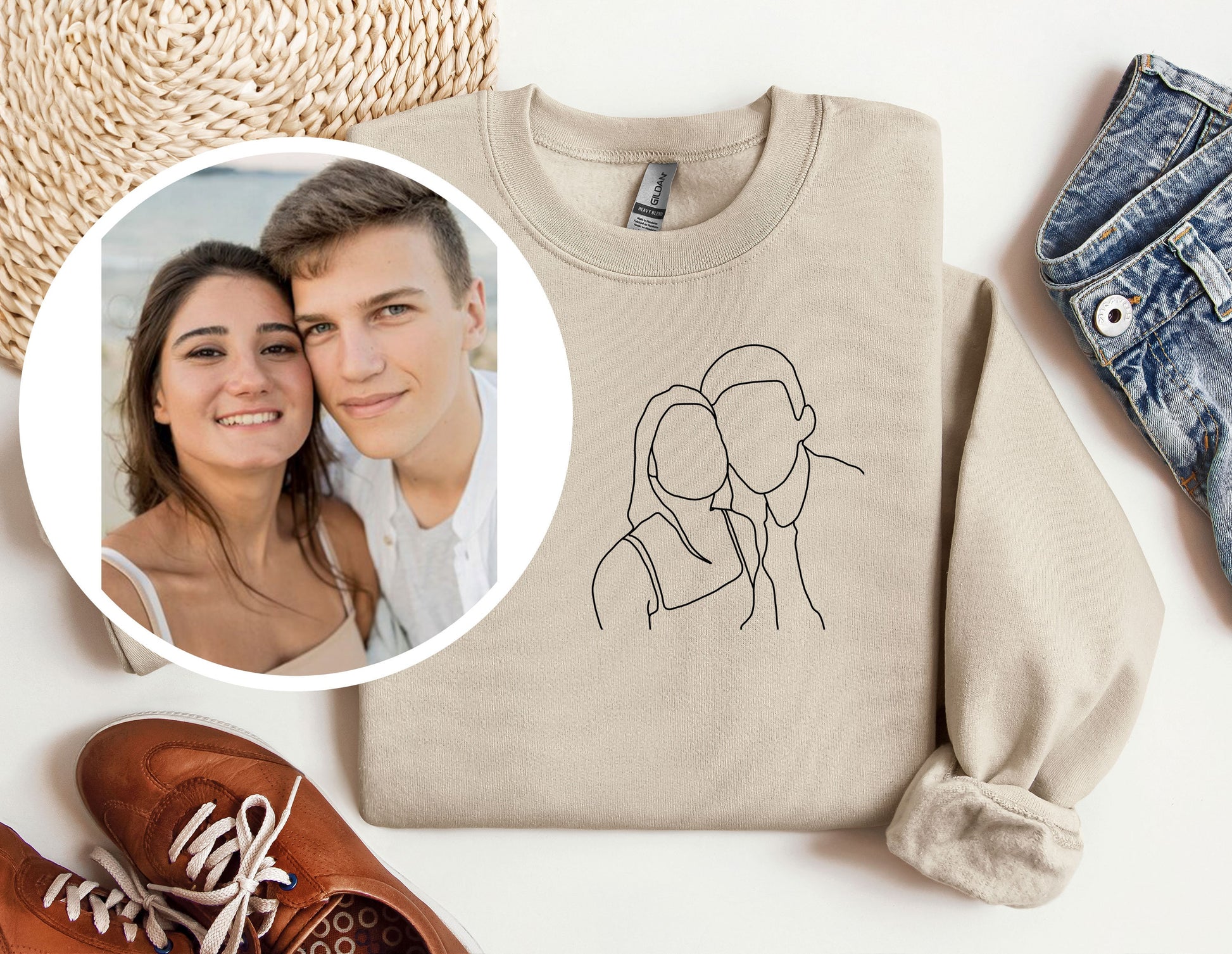 a sweater with a picture of a couple on it next to a pair of shoes