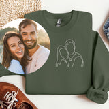 a sweater with a picture of a man and a woman on it