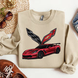 a sweater with a picture of a car on it