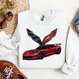 a white shirt with a red sports car on it