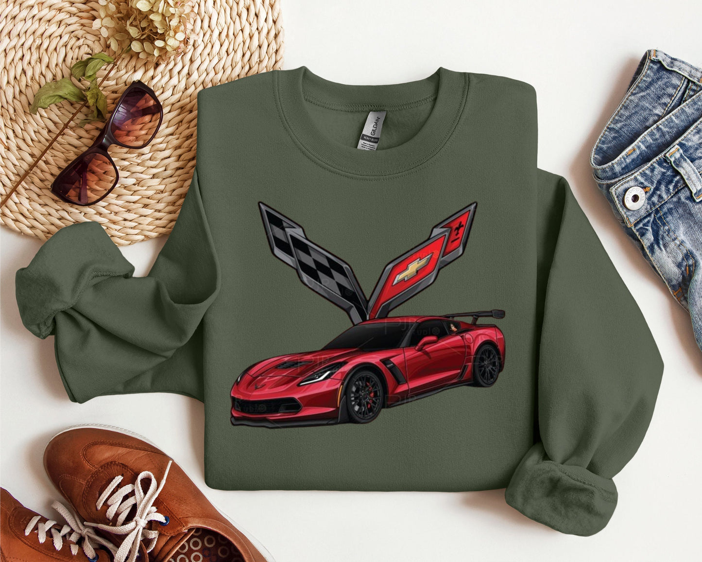 a green sweatshirt with a red sports car on it