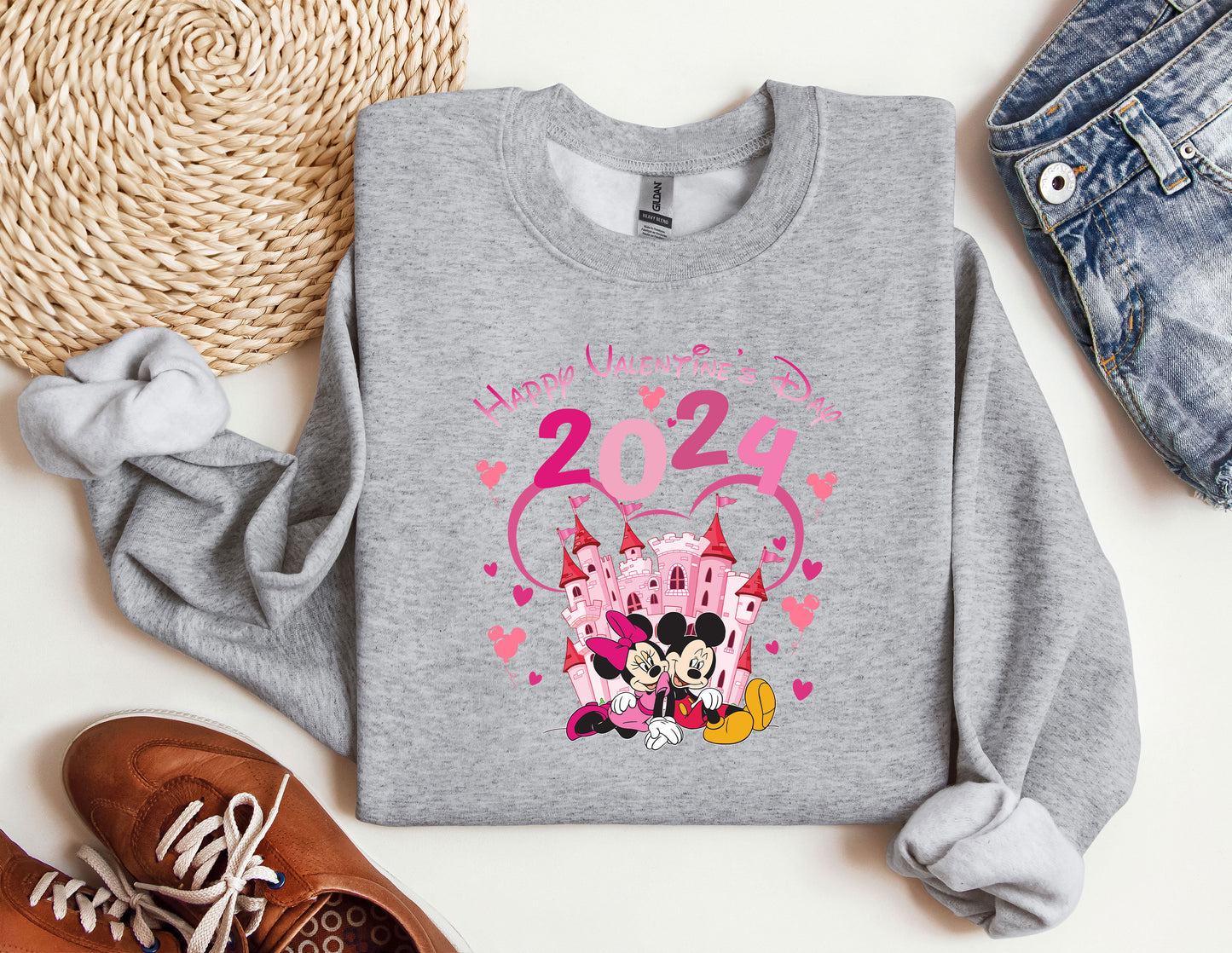 a sweater with a mickey mouse and minnie mouse on it