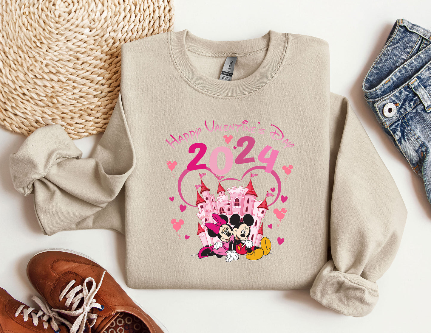 a pair of sneakers and a sweater with a cartoon character on it