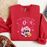 a red shirt with a mickey and minnie mouse on it