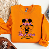 an orange shirt with a mickey mouse design on it