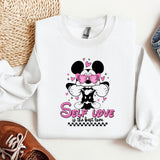 a minnie mouse sweatshirt with a pair of shoes next to it