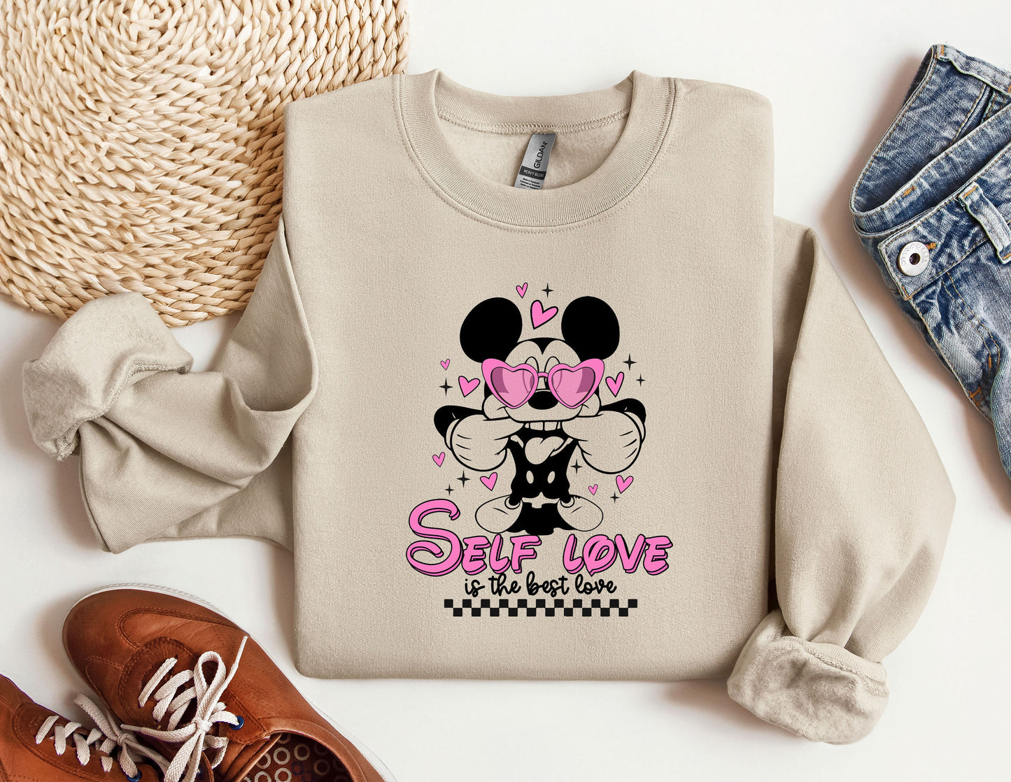 a sweater with a minnie mouse design on it