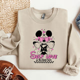 a sweater with a minnie mouse design on it