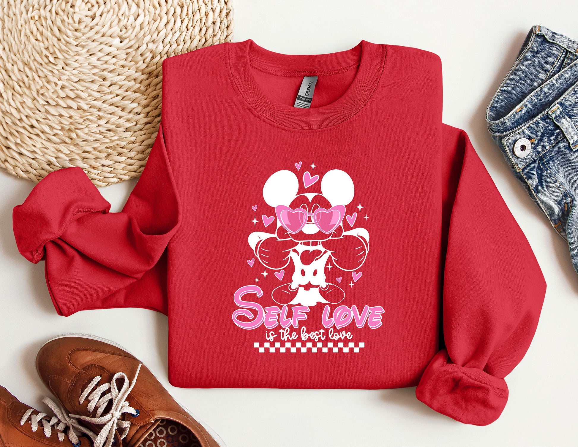 a red sweatshirt with minnie mouse on it