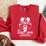 a red sweatshirt with minnie mouse on it