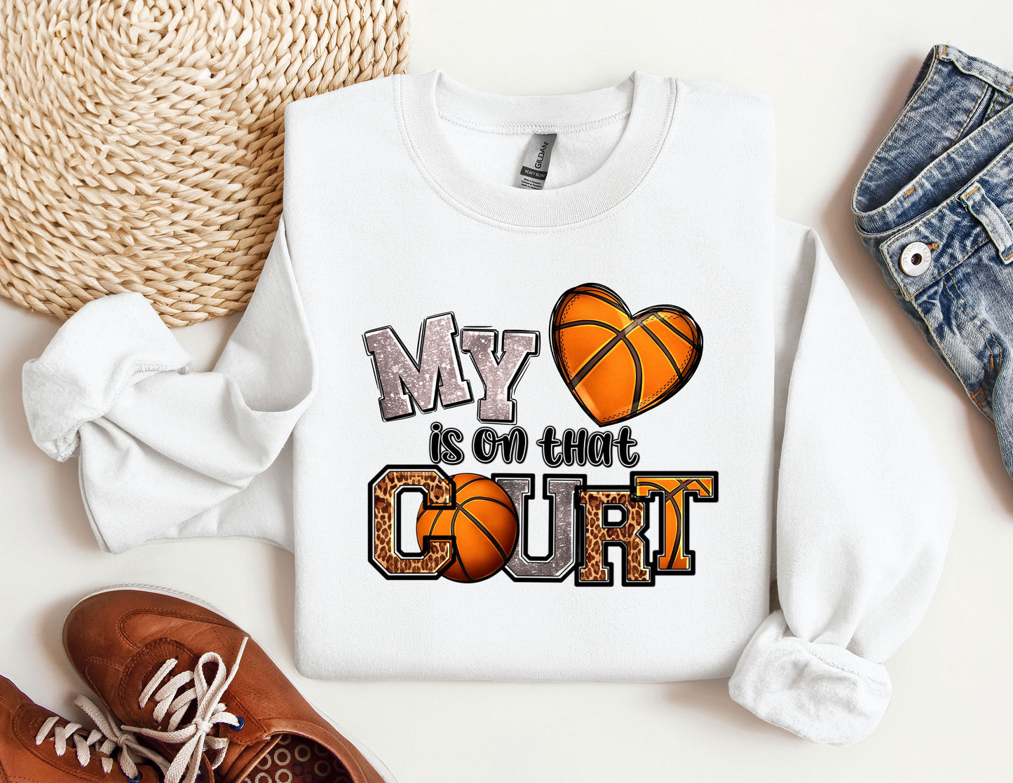 a pair of shoes and a sweatshirt with a basketball on it