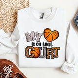 a pair of shoes and a sweatshirt with a basketball on it