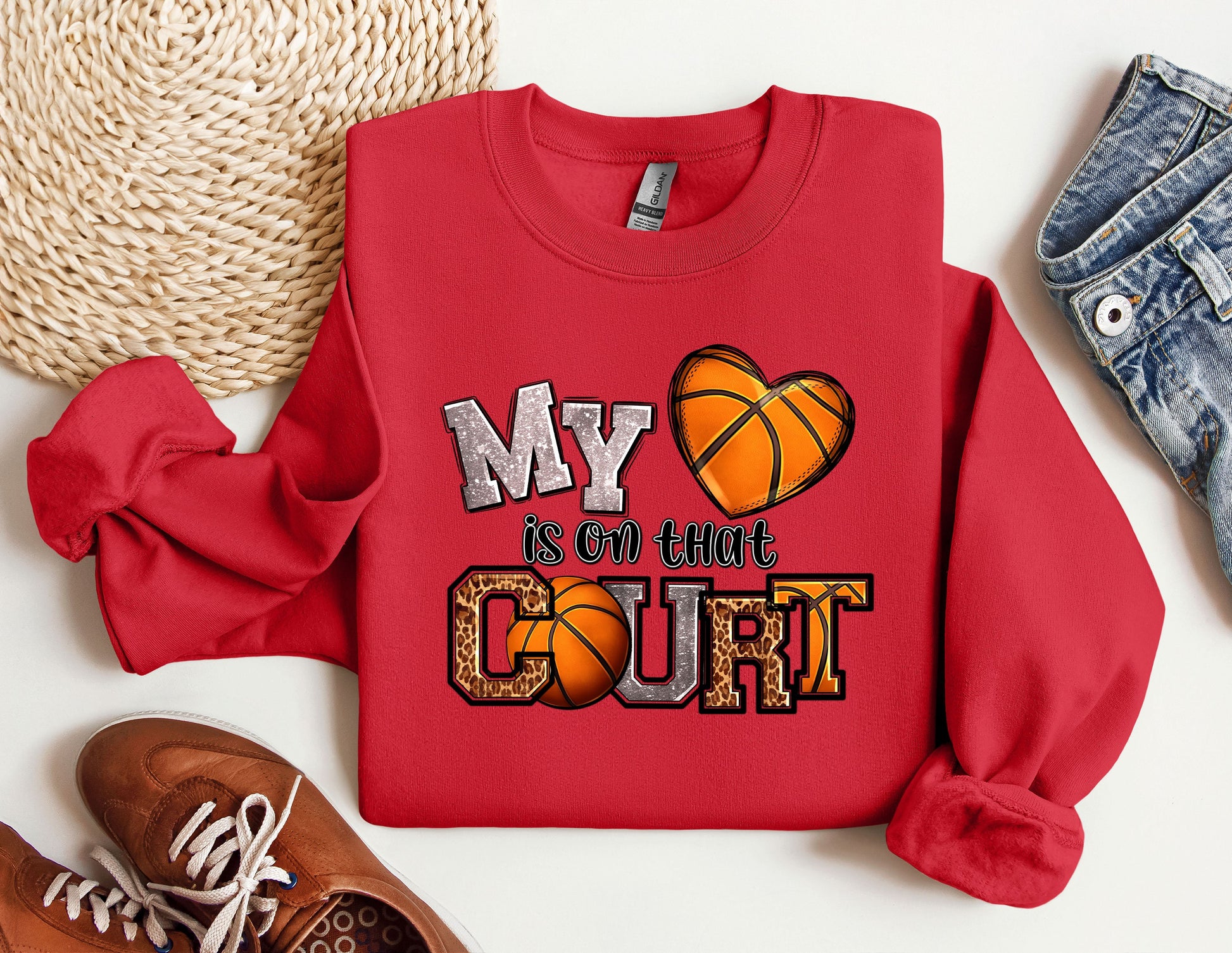 a red sweatshirt with a basketball on it