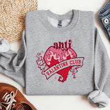 a sweater with a heart and a ribbon on it