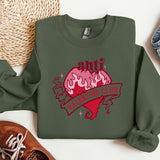 a green sweatshirt with a heart and a ribbon on it