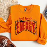 an orange sweatshirt with the words bad bitch energy on it