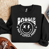 a black sweatshirt with a smiley face on it