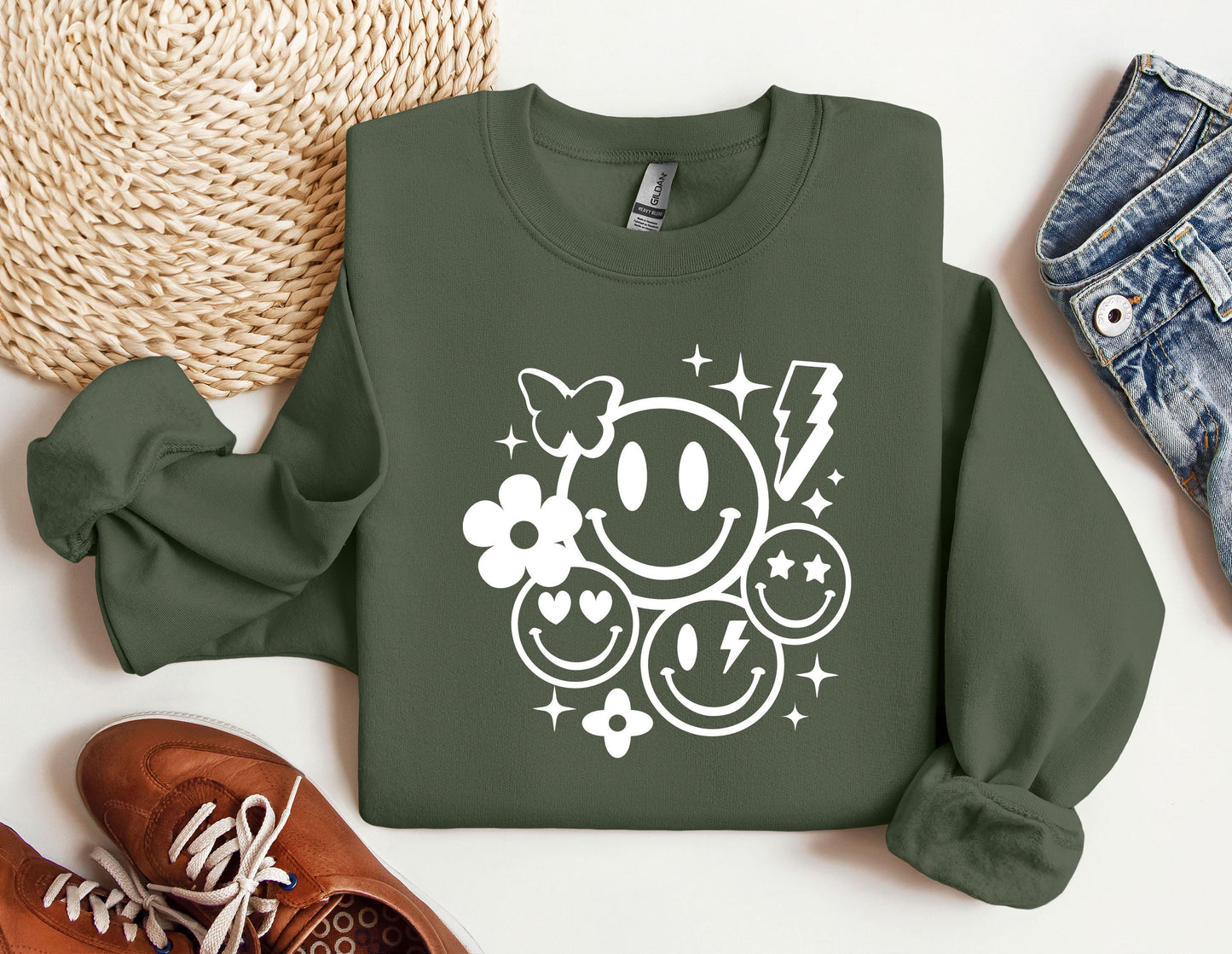 a green sweatshirt with a smiley face on it