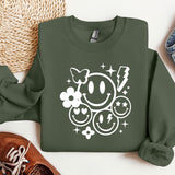 a green sweatshirt with a smiley face on it
