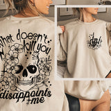 a woman wearing a sweatshirt that says what doesn't kill you